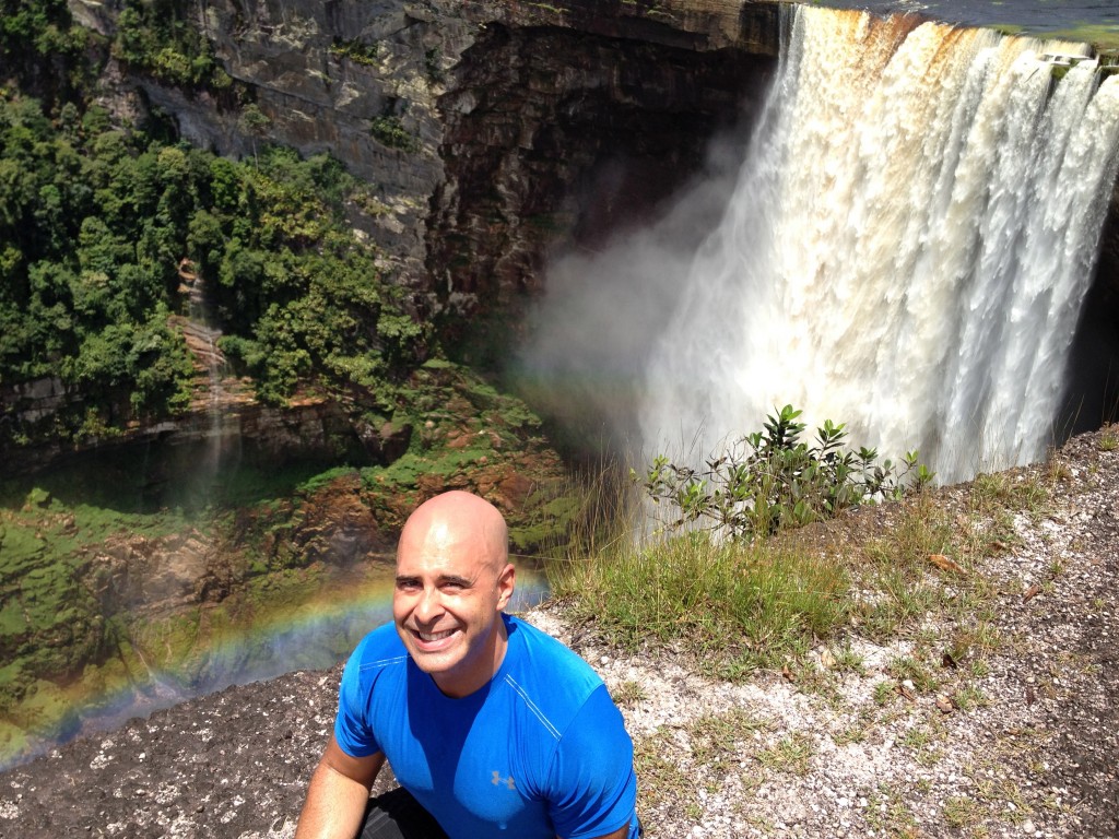 Posing with rainbow in front of Kaieteur Falls